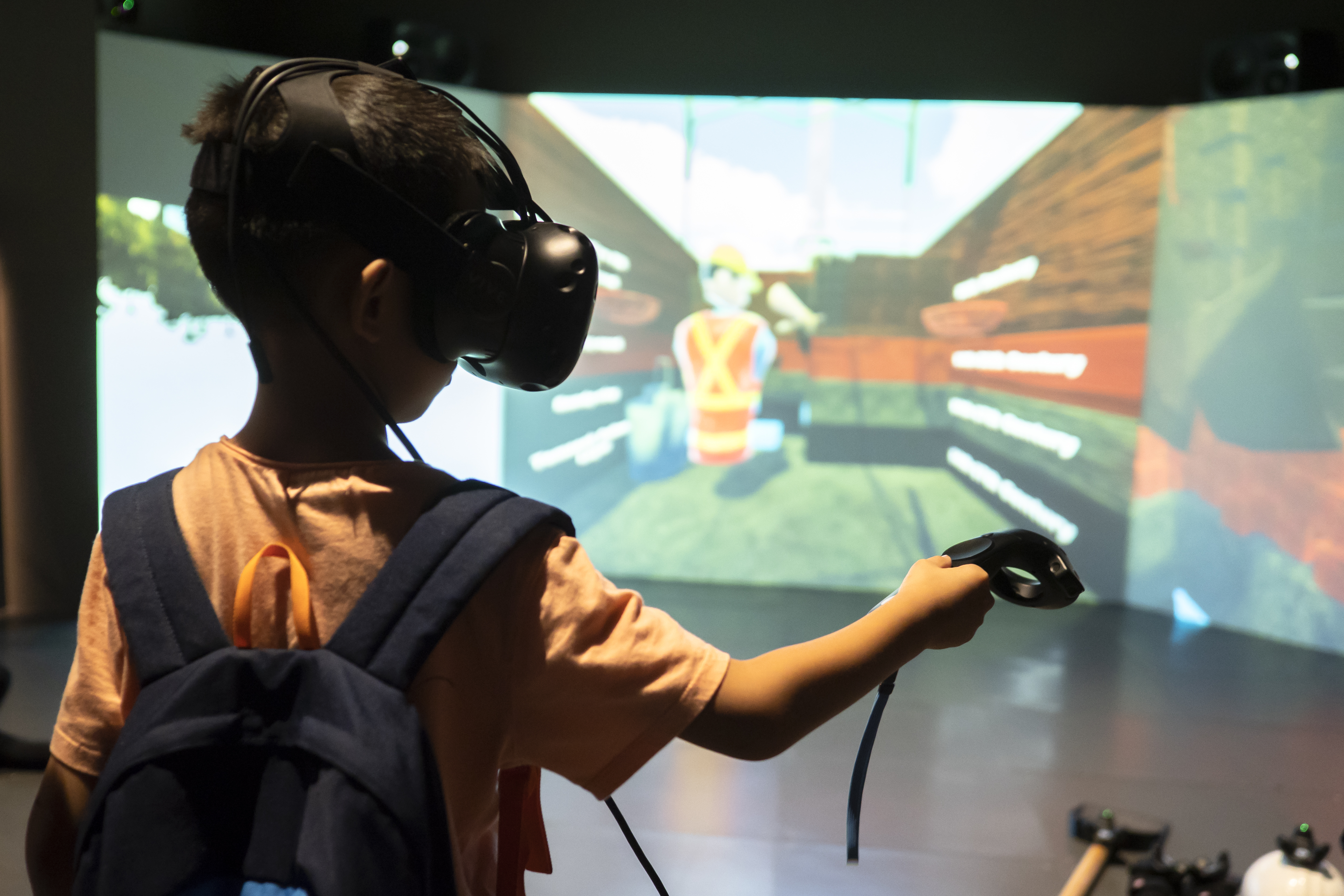 Boy interacting with An Excavation Through Time exhibit