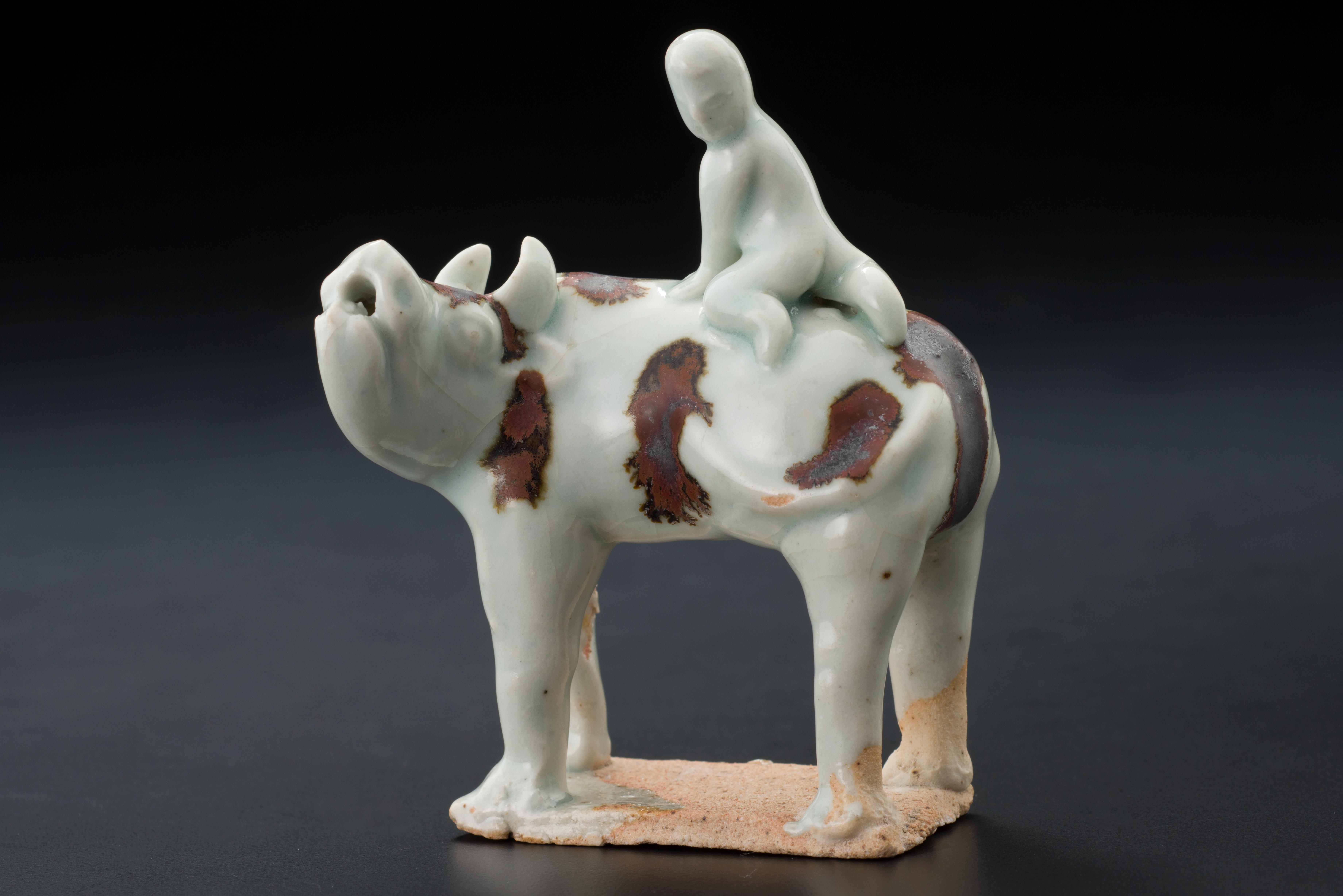 Water dropper in the form of a boy on a cow