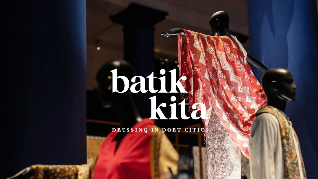 Three manequins wearing batik clothing and the words Batik Kita: Dressing in Port Cities in the middle