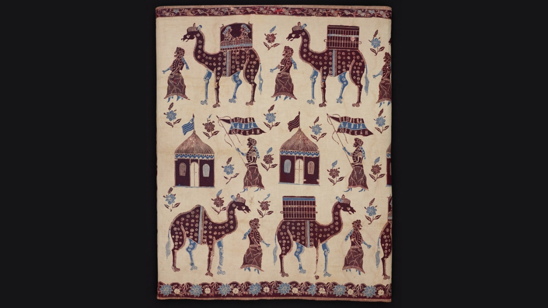 Beige and brown batik sarong cloth with camels and tents