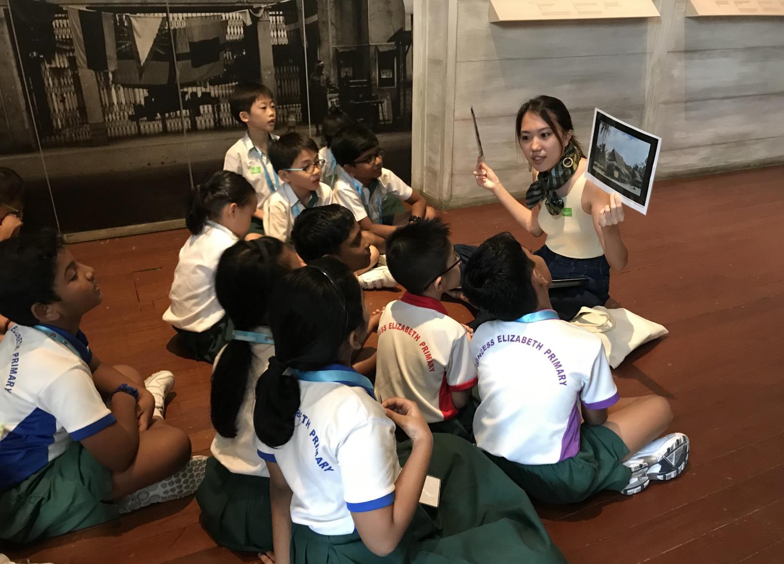 Educator raising her hands